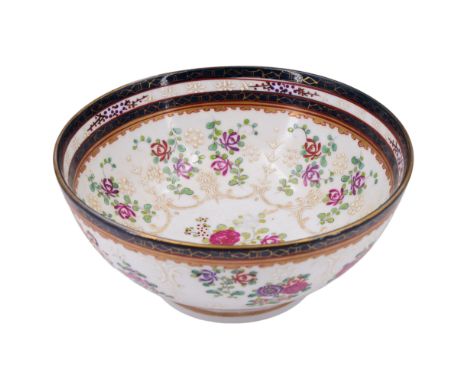 An 18th Century Chinese export style porcelain punch or similar bowl, decorated internally in enamelled patterns of honeysuck