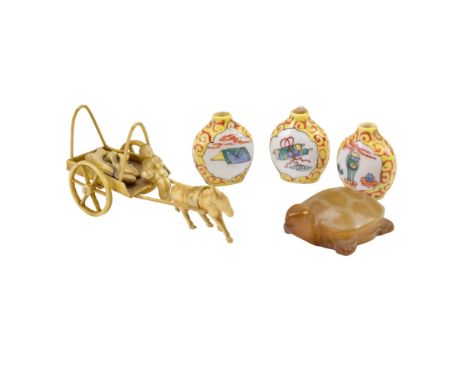 A Chinese carved jade turtle together with three famille jaune snuff bottles and a kitsch celluloid fisherman and cart, snuff