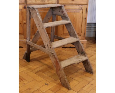 A rustic pine step ladder