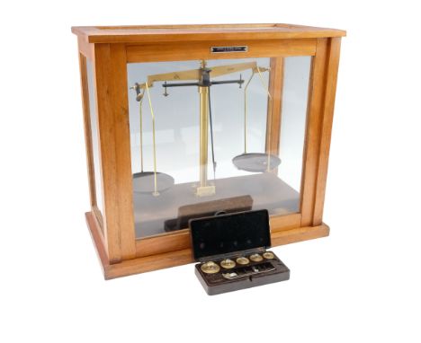 Griffin &amp; George Limited brass and Bakelite analytical balance scales in a glazed cabinet, together with a cased set of w