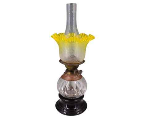 A Victorian oil lamp having a Duplex type burner and compressed oviform cut glass reservoir with oval printies and wheel-cut 