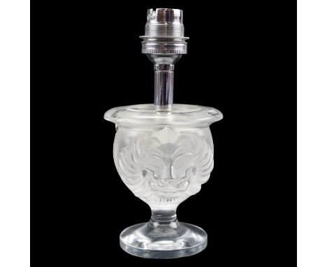 A Lalique frosted glass table lamp decorated with two relief lion's masks, signed to the base and in a Lalique carton, circa 