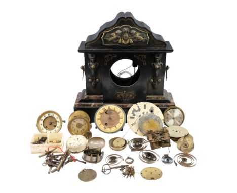A quantity of antique and vintage replacement clock parts including movements, pendulums, faces and keys together with the ca