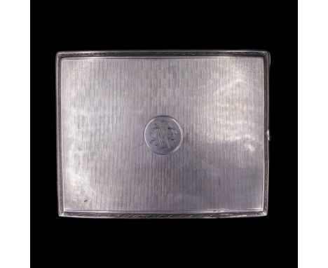 A George V silver cigarette case decorated with alternating linear engine turning centred by a circular cartouche bearing an 