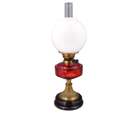 A Victorian ruby glass and gilt metal oil lamp, 55 cm 