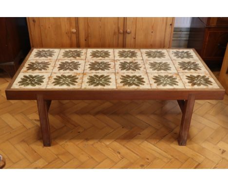 A tile-topped teak coffee table, 126 cm x 65 cm x 53 cm