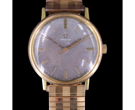 A 1960s Omega  wristwatch, having a calibre 601 17-jewel movement and circular finely cross-hatched black face with slender g