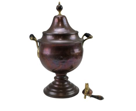A large Victorian copper and brass tea urn having turned and ebonised wooden handles and finial, 52 cm, (a/f)