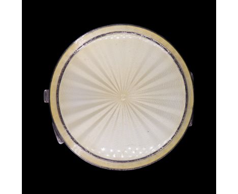 A 1930s enamelled silver powder compact, the lid rose engine turned and pale achromatising yellow basse taille enamelled, Tur