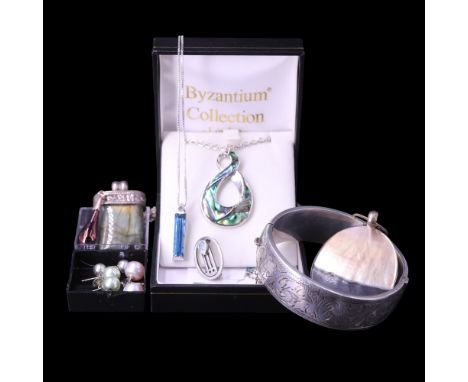 A silver hinged bangle together with abalone and mother-of-pearl pendants, a Charles Rennie Mackintosh style blue topaz and w
