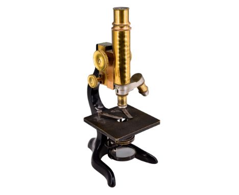 A 1908 lacquered brass microscope by Ernst Leitz Wetzlar / London, having a two-lens turret, engraved J Lizars Optician of Gl