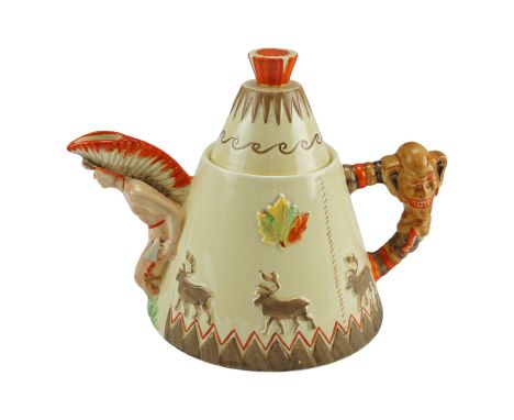 A Clarice Cliff "Greetings from Canada" novelty teapot the body modelled in the form of a teepee, the handle a totem pole and