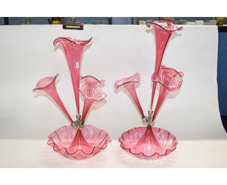 A late 19th Century cranberry epergne together with a smaller example, largest 54cm high