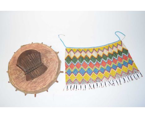 ZIMBABWEAN Mbira (Musical Instrument) and Beaded Apron or Loincovering 22cm x 34cm (2)Provenance; brought back from Rhodesia 