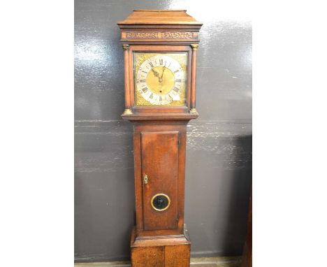 John Mercer Hythe, an 18th Century long case clock with brass and silvered dial decorated with pierced spandrels, fitted with