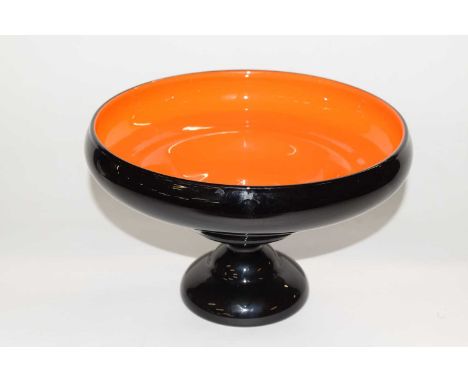 A  glass centrepiece, possibly Italian, the black glass exterior with an orange glass interior with shaped bowl, 24cm diamete
