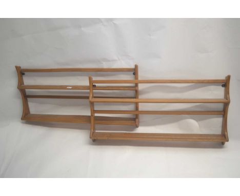 A pair of light Ercol wall mounted shelves, 96cm wide