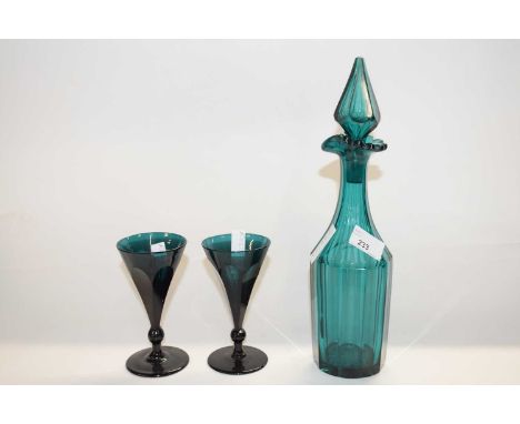 Two shaped Bristol green glasses with trumpet bowls together with a matching decanter with diamond shaped stopper, decanter 3