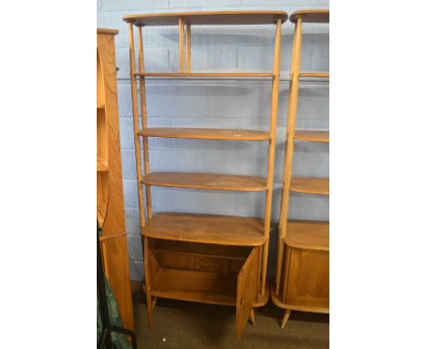 An Ercol light elm tall adjustable shelf unit with cupboard base, 190cm highAppears in good used condition with minor scuffs 