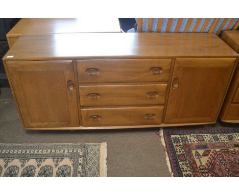 An Ercol light elm low sideboard with two doors and three central drawers, 155cm wide