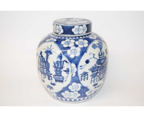 A 19th Century Chinese porcelain jar and cover with prunus decoration, well painted with panels of precious objects in Kangxi