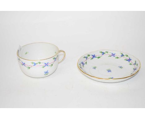 A Herend breakfast cup and saucer with blue floral design