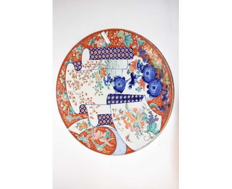 A large Japanese porcelain charger, Meiji period with polychrome design, 47cm diameter