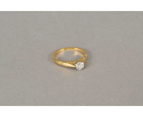 A single stone diamond ring, the brilliant cut diamond claw set in white metal to yellow metal shank, stamped '18ct plat', ri