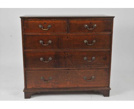 A George III style country oak chest of two long and three graduating long drawers, the bordered caddy top above cock-beaded 
