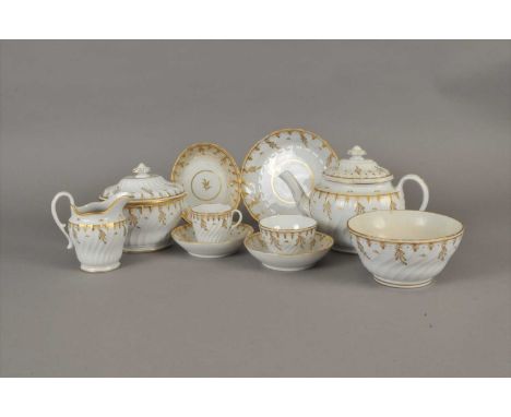 A Worcester porcelain part tea service circa 1780-90 of wrythen, fluted form and decorated in gilt with gilt bands and pendan