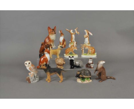 A small collection of John Beswick and other animals comprising four "I Love You" hare groups, a badger, barn owl, two foxes,