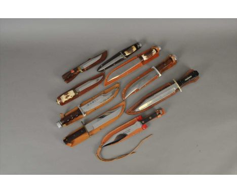 A collection of nine assorted hunting and bowie knives, including examples with stag antler handles, including the manufactur
