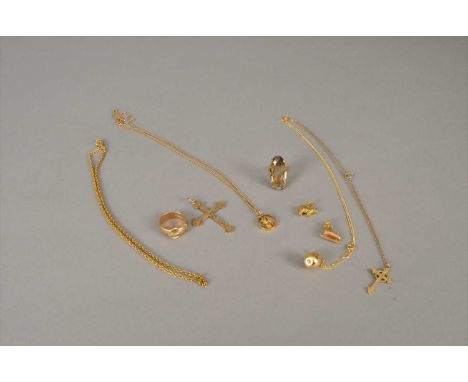 A small collection of gold chains and rings, comprising; a yellow metal crucifix pendant on chain, stamped '9ct', a 9ct gold 