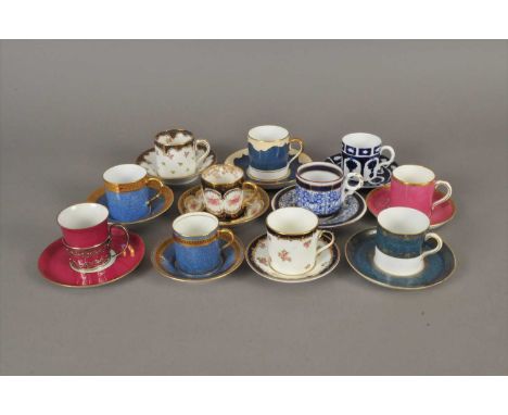 Eleven demitasse coffee cans and saucers, 20th century, including a Crown Staffordshire example decorated with pink roses bel