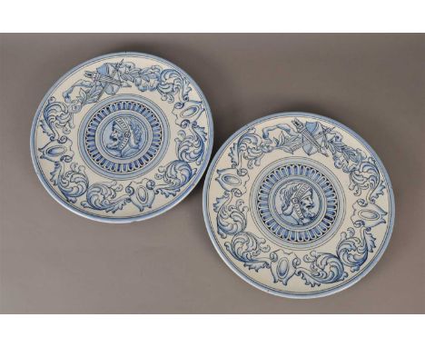 A pair of Spanish 'Mallorca' chargers, late 19th/early 20th century decorated in underglaze blue with central portrait rounde