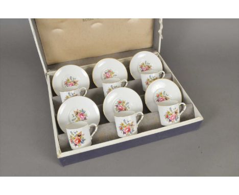 A Royal Worcester cased coffee service mid-20th century transfer-printed with polychrome floral sprays, comprising six coffee