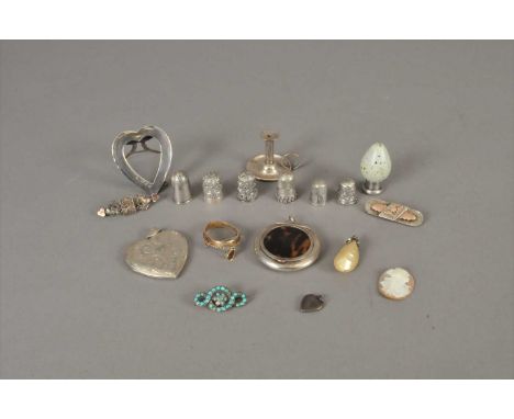 A small collection of silver and bijouterie, to include; a miniature silver chamberstick, London 1892, a circular silver comp