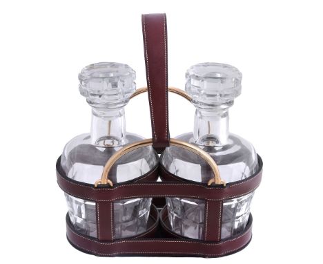 Hermes, a burgundy leather and gilt metal two bottle decanter carrier Hermes, a burgundy leather and gilt metal two bottle de