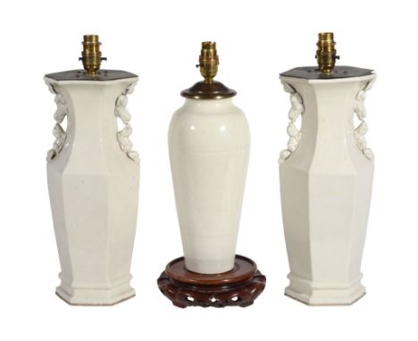 A pair of Chinese cream glazed ceramic vases fitted as table lamps   A pair of Chinese cream glazed ceramic vases fitted as t
