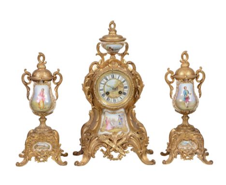 A gilt-metal and porcelain clock garniture de cheminée L A gilt-metal and porcelain clock garniture de cheminée L. Marti &amp
