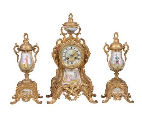 A gilt-metal and porcelain clock garniture de cheminée L A gilt-metal and porcelain clock garniture de cheminée L. Marti &amp