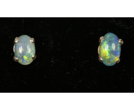 A cased pair of 9ct opal doublet ear studs. 