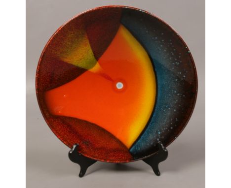 A limited edition Poole pottery orbit dish. 