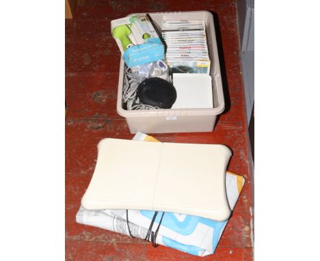A Wii balance board, dumbbells, console, dance mat, Wii fit accessories and 17 games etc. 