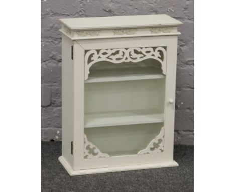 A white painted glass front three shelf bathroom cabinet. 