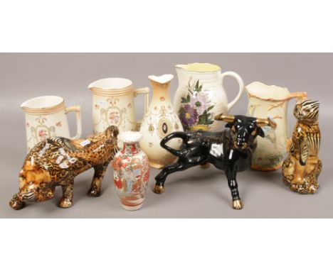 A collection of ceramics to include Crown Devon, Arthur Wood, decorative bull figures etc. 