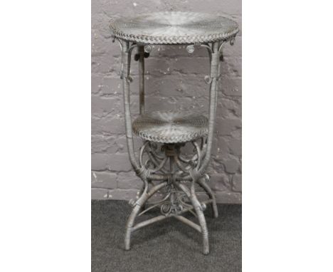 A basketware two tier side table. 