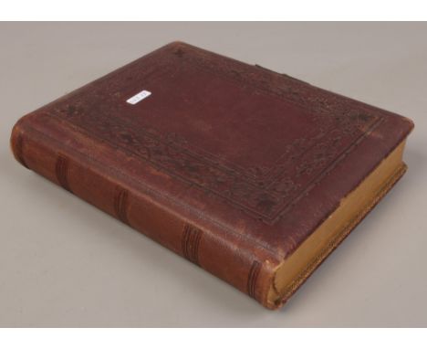 A Victorian photograph album with contents of portrait photographs. 