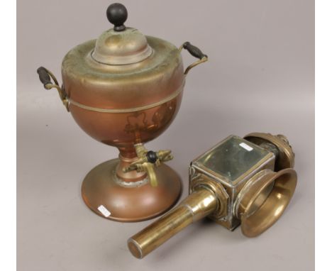 An old brass coach lamp, along with a copper and brass samovar. 