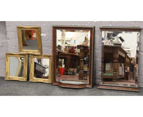 Two mahogany bevel edge wall mirrors, one with mirrored shelf, along with three gilt framed mirrors. 